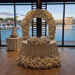 White Rose Arch and Florals, 12 Sand Wax candles, 6 Tall Clear Candles