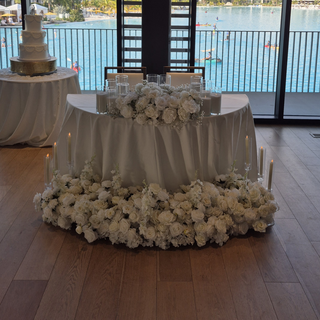White Rose Florals,  12 Sand Wax Candles, 7 Tall Clear Candles